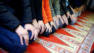 Muslims pray during Friday prayers at the Cuba Camii mosque in Cologne